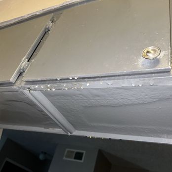 Tradewind Apartments - Water damage where the leaking roof has gone into her cabinets - Apartments Near Me - Texas City, Texas Tradewind Apartments - Water damage where the leaking roof has gone into her cabinets - Apartments Near Me - Texas City, Texas