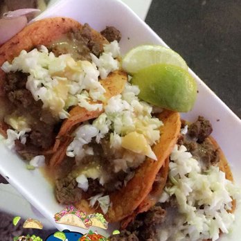 Tacos La Bomba - Tacos de asada with the tortilla dipped in a red sauce amazing even because they have cabbage. - Street Vendors Near Me - Norwalk, California Tacos La Bomba - Tacos de asada with the tortilla dipped in a red sauce amazing even because they have cabbage. - Street Vendors Near Me - Norwalk, California