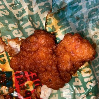 Wingstop - a fried chicken sandwich in a wrapper - Chicken Wings Near Me - Longview, Texas