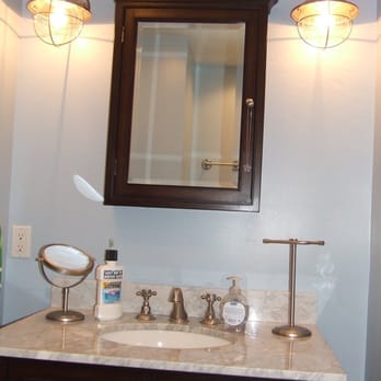 Bartler Marble,Tile and More - a bathroom vanity with a mirror - Flooring Near Me - Antioch, Illinois