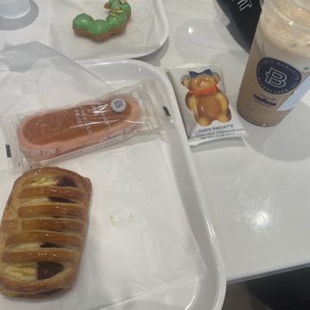 Paris Baguette - Pistachio Mochi Donut Cherry Greek Yogurt Danish Ms. Bear Iced Chai Latte - Bakeries Near Me - Kennesaw, Georgia Paris Baguette - Pistachio Mochi Donut Cherry Greek Yogurt Danish Ms. Bear Iced Chai Latte - Bakeries Near Me - Kennesaw, Georgia