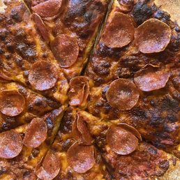 Burned pepperoni pizza from Marcos
