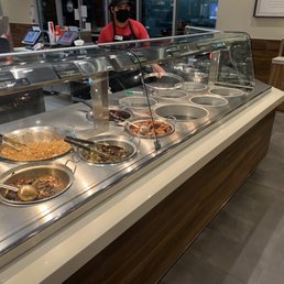 Service bar with empty pans... already sparkling clean because they stopped cooking hours ago. Service bar with empty pans... already sparkling clean because they stopped cooking hours ago.