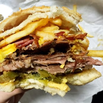 Getta Burger - Getta Boss Burger (partially consumed) with fries added. - Burgers Near Me - Bridgeman Downs, QLD Getta Burger - Getta Boss Burger (partially consumed) with fries added. - Burgers Near Me - Bridgeman Downs, QLD