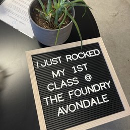 A black letter board with white plastic letters displays a message about attending a class at The Foundry in Avondale, AZ.
