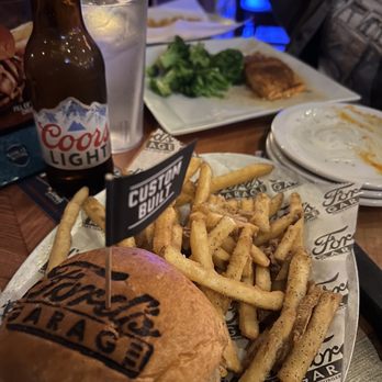 Ford's Garage Plano - Hamburger, French fries and Salmon with broccoli - Burgers Near Me - Plano, Texas