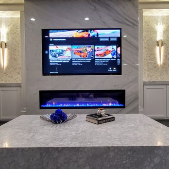 Appleton Renovations - 77" LG OLED TV, marble stone work, 74" electric LED fireplace, ceiling speakers and theater sound system. - Home Theatre Installation Near Me - Eagle, Idaho