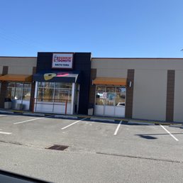  the outside of a dunkin donuts store