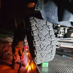 Code Red Towing  - Lug stubs busted off my right tire... getting ready to strap it down