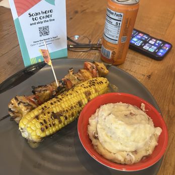 Nando's Peri-Peri - Chicken skewer, grilled corn and mashed potatoes and a peach tea - Portuguese Near Me - North Bethesda, Maryland Nando's Peri-Peri - Chicken skewer, grilled corn and mashed potatoes and a peach tea - Portuguese Near Me - North Bethesda, Maryland