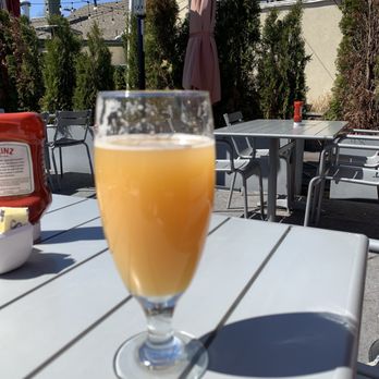 The Patio - a glass of orange juice on a table - New American Near Me - New Providence, New Jersey The Patio - a glass of orange juice on a table - New American Near Me - New Providence, New Jersey