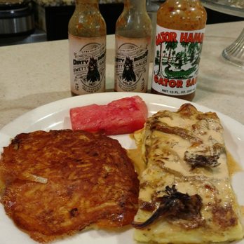 Clary's Corner Cafe - OMG Breakfast Enchiladas with hash brown casserole and watermelon... And awesome local and state hot sauces. - Cafes Near Me - Lake Worth, Florida