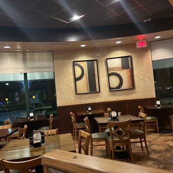 Dominic's - a dining area with tables and chairs - Italian Near Me - Boynton Beach, Florida