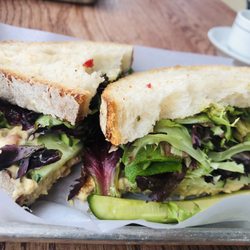Baked Bread & Pastry - Texas Fresh. Sourdough bread with humus, greens, cucumber , pesto...