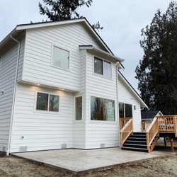 New siding, windows, patio, and deck.