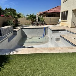 Draining the pool for acid wash and calcium buildup removal.