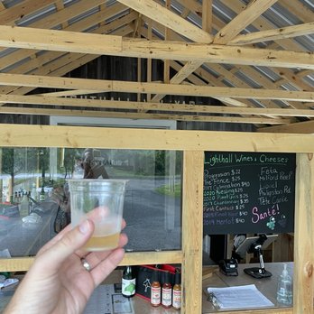 Lighthall Vineyards - a hand holding a glass of wine - Wineries Near Me - Milford, Ontario Lighthall Vineyards - a hand holding a glass of wine - Wineries Near Me - Milford, Ontario