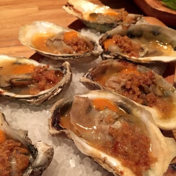 Husk - Fire roasted oysters with fermented pepper mash and fried chicken fat - American Near Me - Charleston, South Carolina