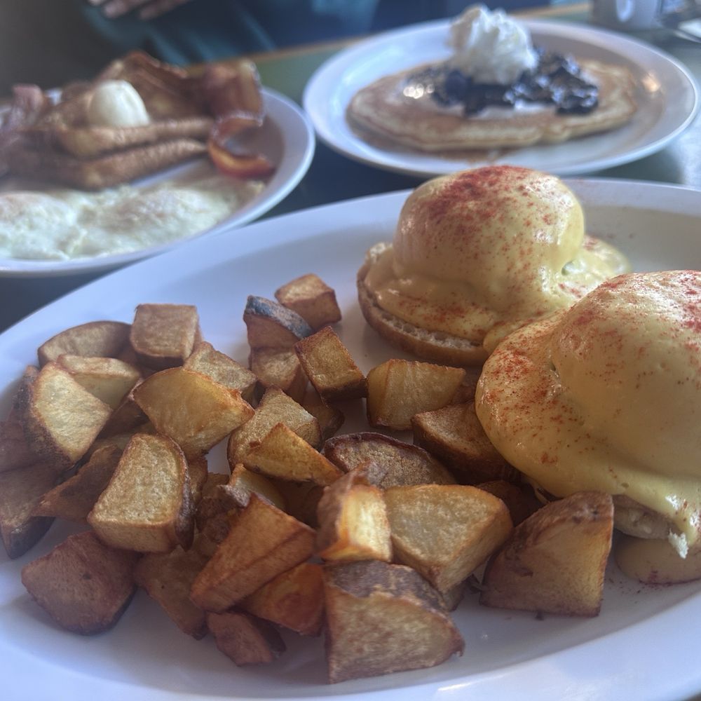 Eggs Benedict with Shrimp Cakes, home fries, blueberry pancakes Eggs Benedict with Shrimp Cakes, home fries, blueberry pancakes