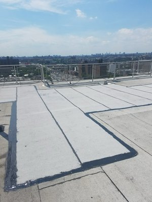Flat Roof work done by V-Build Contractors - This project involves a full-service roofing installation/repair designed to ensure long-term durability, weather protection, and improved property value. Work includes removal of existing roofing materials, thorough inspection of the roof deck, and replacement of any damaged wood as needed.
A high-quality underlayment will be installed to provide a moisture barrier, followed by premium roofing materials (shingles or flat roofing system) applied according to manufacturer and NYC building code standards. All flashing, vents, and drainage components will be properly sealed and secured to prevent leaks and ensure proper water flow. Flat Roof work done by V-Build Contractors - This project involves a full-service roofing installation/repair designed to ensure long-term durability, weather protection, and improved property value. Work includes removal of existing roofing materials, thorough inspection of the roof deck, and replacement of any damaged wood as needed.
A high-quality underlayment will be installed to provide a moisture barrier, followed by premium roofing materials (shingles or flat roofing system) applied according to manufacturer and NYC building code standards. All flashing, vents, and drainage components will be properly sealed and secured to prevent leaks and ensure proper water flow.