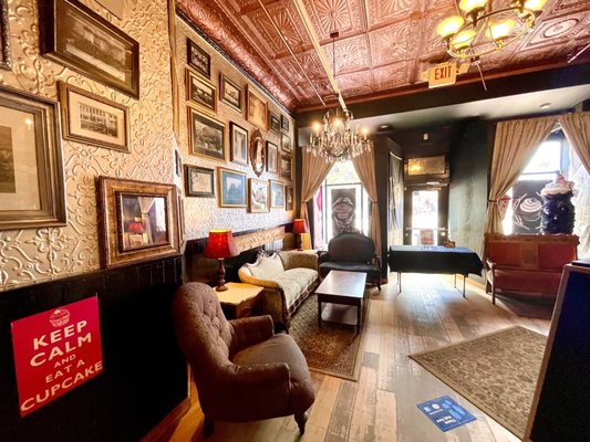 Photo of NoRA Cupcake Company - Middletown, CT, US. Seating in front looks like an old Victorian house