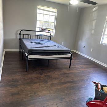 Rockos Renovations - We laid a nice sub flooring with a wood looking vinyl flooring. We also replaced the baseboards/door trims and updated the ceiling fan. - Handyman Near Me - Edgewater, Florida