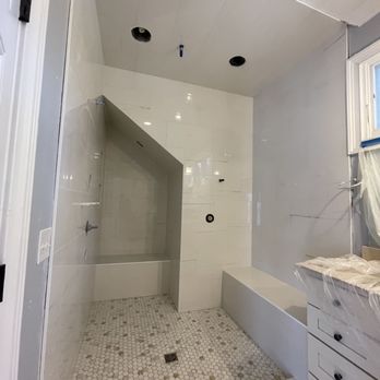 New Tile - a bathroom with a walk in shower - Flooring Near Me
