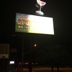 Gurley Street Sports Pub - Old school neon martini glass above the Bar sign