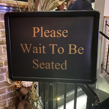 The District - "Wait" sign - American Near Me - Providence, Rhode Island The District - "Wait" sign - American Near Me - Providence, Rhode Island