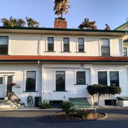 Rain Gutters Unlimited - Gutters were installed to both top and bottom levels, with 2 spouts and rain barrels added. They did this old house proud!