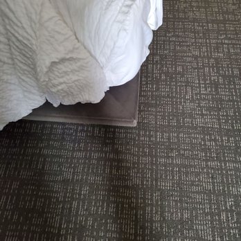 Courtyard by Marriott Portsmouth - Bed is on a piece of 4 x 8 pressed sheet board. Not even a real bedframe. Kept hitting it with our legs. Black n blue now. - Hotels Near Me - Portsmouth, New Hampshire