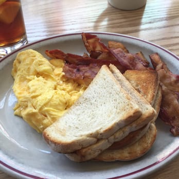 Sugar Magnolia's - Scrambled eggs, bacon, and home fries hiding under the toast. - Breakfast & Brunch Near Me - Gloucester, Massachusetts