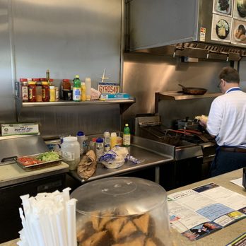 Pappas Grill - a man and a woman preparing food - Greek Near Me - Vestavia Hills, Alabama Pappas Grill - a man and a woman preparing food - Greek Near Me - Vestavia Hills, Alabama