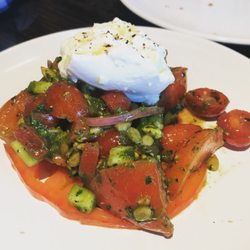 Peacemaker Lobster and Crab - Heirloom tomato salad with cheese on top. So flavorful