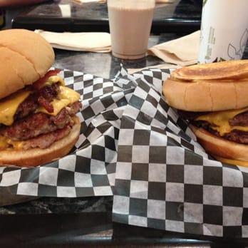 Holy Chuck - Farmers Threesome Burger (left) and Cowlorie burger (right) - Burgers Near Me - Toronto, Ontario Holy Chuck - Farmers Threesome Burger (left) and Cowlorie burger (right) - Burgers Near Me - Toronto, Ontario