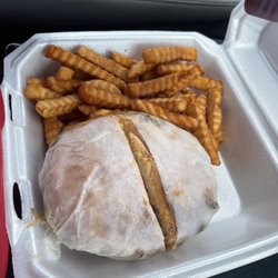 Manhattan Deli and Grill II - Philly cheesesteak on a bun with a side of crispy fries