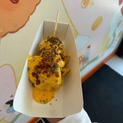 Chung Chun Rice Hot Dog - Nacho Hot Dog: Nacho Cheese, Tortilla Chips, Bacon & Beef Hot Dog