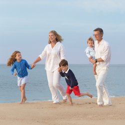 Lucille Khornak Photography - A fun moment when the family is running on the beach for our family photography session! Moments to be captured.