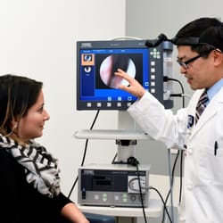 Mas Takashima, MD, FACS, FAAOA - Dr. Mas Takashima explaining the results of a scope to a patient.