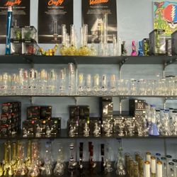 Moon Smoke Shop - Assorted glass bongs and wax rigs.