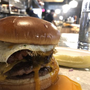 Au Cheval - Single with everything, added bacon egg and foie gras!  Look at that yolk - Bars Near Me - Chicago, Illinois