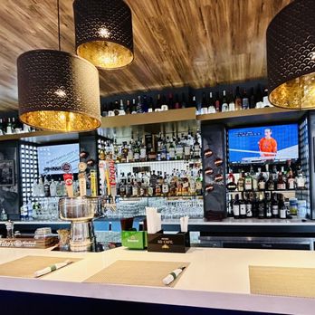 Orange Hill Restaurant - Facing a bar with top shelf liquors - New American Near Me - Newburgh, New York