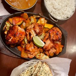 Chicken Tikka Masala, Basmati Rice, Chicken Tikka, and Garlic Herbal Naan