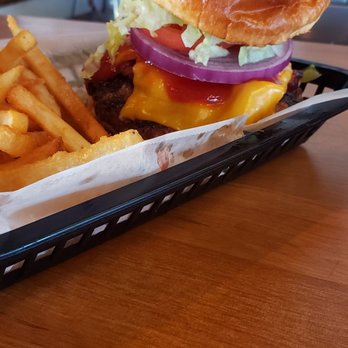 Mugsy's - a hamburger and fries on a tray - Wraps Near Me - East Bloomfield, New York Mugsy's - a hamburger and fries on a tray - Wraps Near Me - East Bloomfield, New York