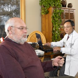 Hearing of America - Dr. Jerry is providing hearing care at the patient's home.