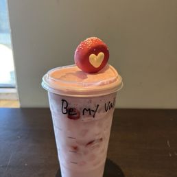 pink drink with white chocolate strawberry cold foam and valentine's day cake pop pink drink with white chocolate strawberry cold foam and valentine's day cake pop