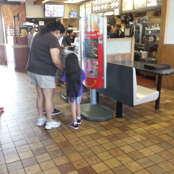 McDonald's - a woman and a little girl standing in front of a vending machine - Fast Food Near Me - White Haven, Pennsylvania
