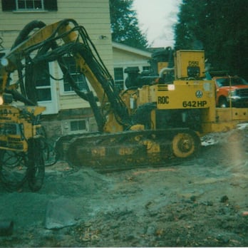Rock Splitters - a bulldozer and a small excavator - General Contractors Near Me