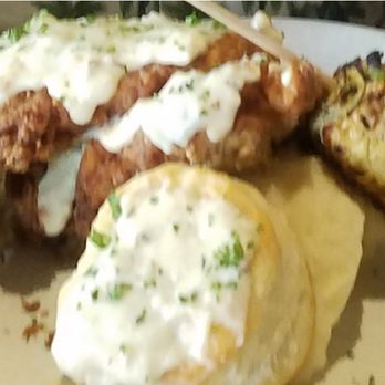 Nick's Manhattan Beach - BUTTERMILK FRIED CHICKEN served boneless with whipped mashed potatoes, buttermilk biscuit, country gravy, roasted sweet corn on the cob - American Near Me - Manhattan Beach, California