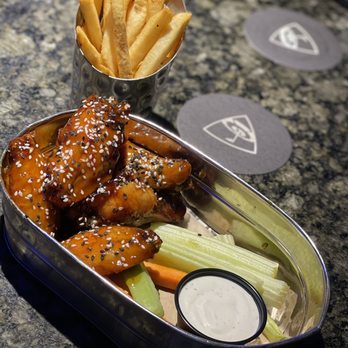 Topgolf - Asian Sesame Wings with fries - New American Near Me - Orlando, Florida Topgolf - Asian Sesame Wings with fries - New American Near Me - Orlando, Florida